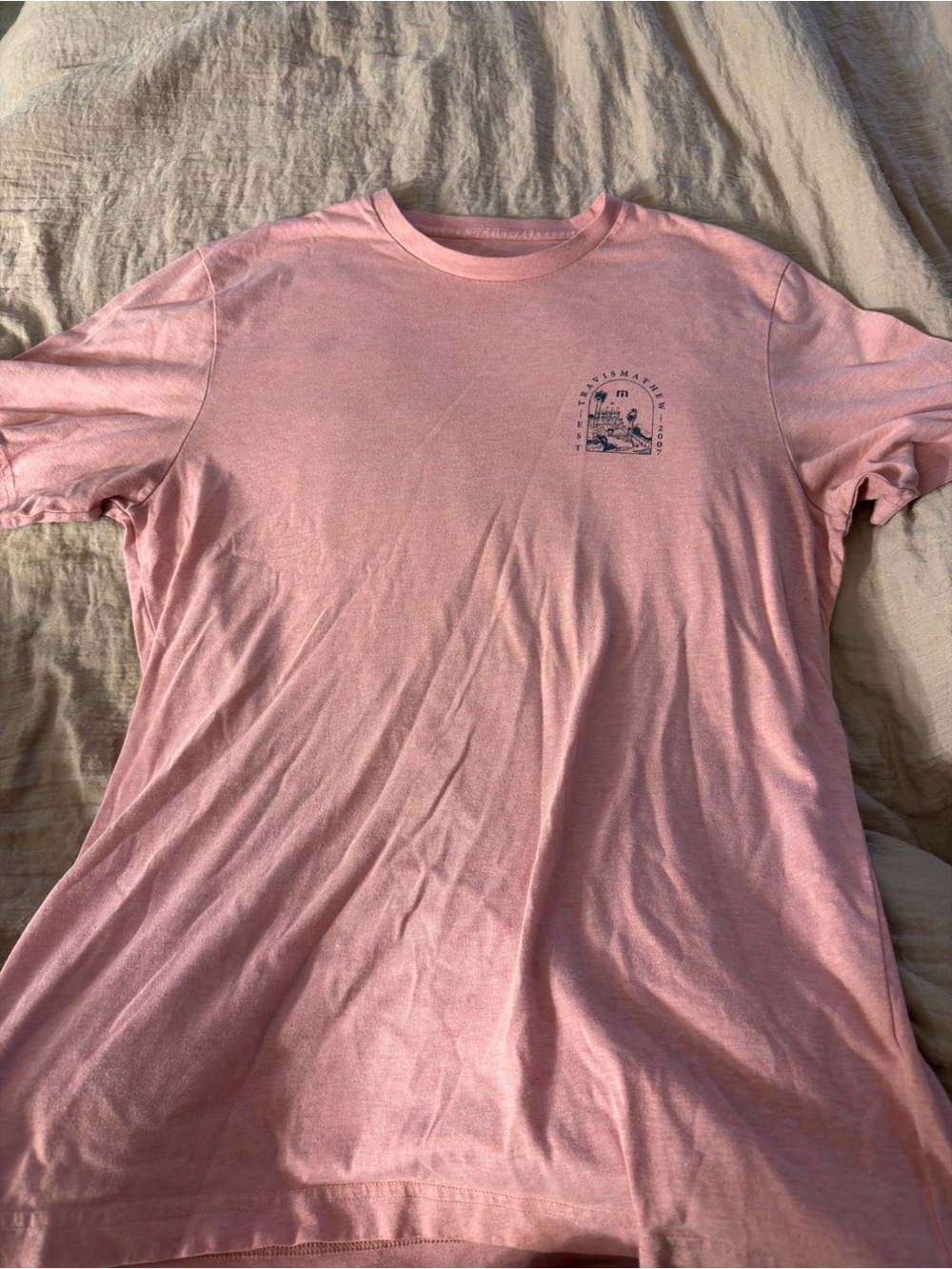 Travis Mathew Pink Crewneck Tee with Small Chest Graphic